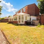 Spacious garden with a conservatory.