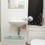 Compact bathroom with modern fixtures.
